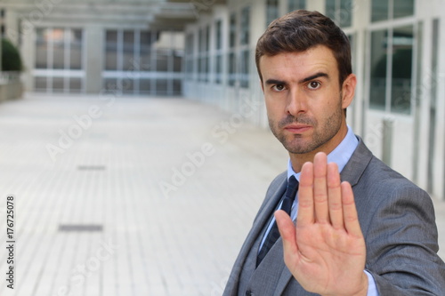 Businessman with a STOP hand gesture photo