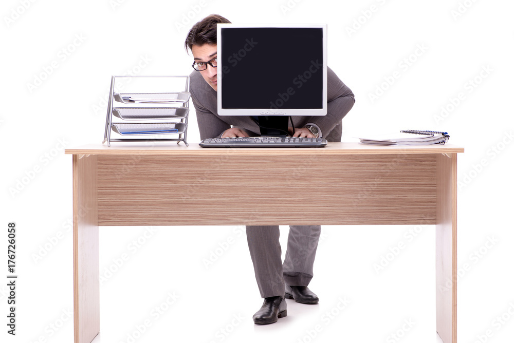 Businessman hiding in the office isolated on white Businessman hiding in the office isolated on white