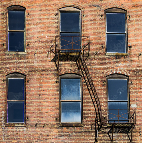 Red Brick Building with Windows and Fire Escape