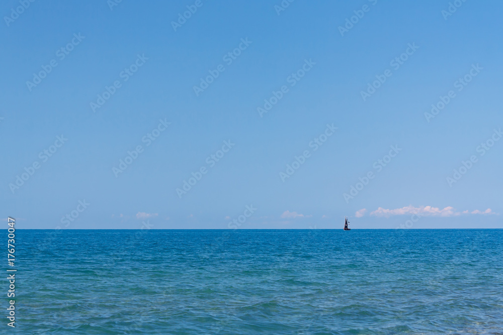 Charming sea view of the calm sea under a blue sky Charming sea view of the calm sea under a blue sky