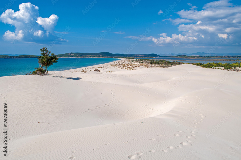 Blue sky, clear sea and sand dunes on the island of Sardinia, Porto Pino