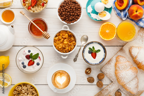 Continental breakfast menu on woden table