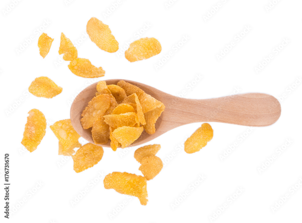 Corn flakes in wooden spoon isolated on white background Corn flakes in wooden spoon isolated on white background