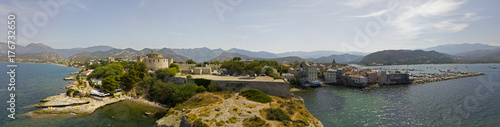Vista aerea del paese di Saint Florent, Corsica. Francia. Porto barche e case © Naeblys