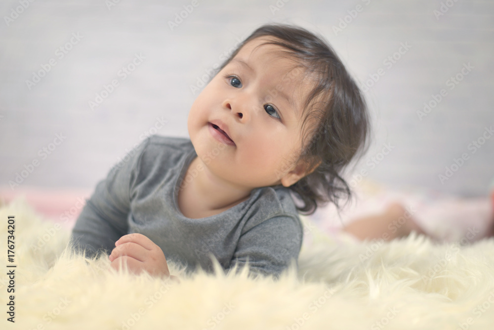 Sweet Beautiful baby girl playing on beautiful white furry.Newborn baby concept. Sweet Beautiful baby girl playing on beautiful white furry.Newborn baby concept.