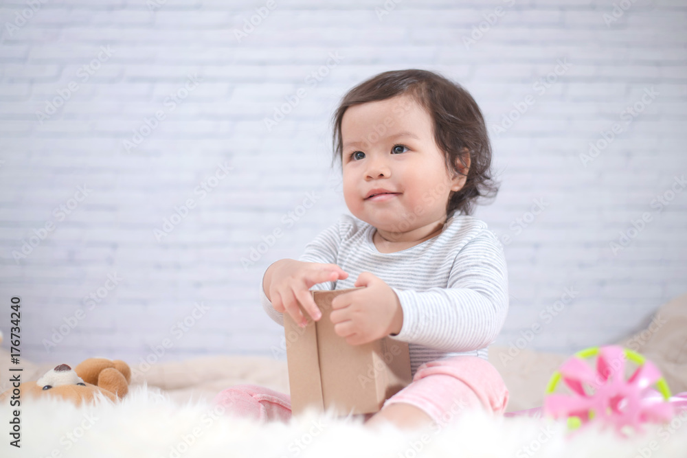 Sweet Beautiful baby girl playing on beautiful white furry.Newborn baby concept. Sweet Beautiful baby girl playing on beautiful white furry.Newborn baby concept.