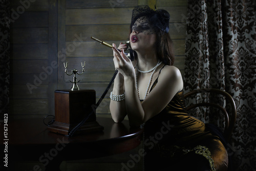 Beautiful 1930s girl smokes
