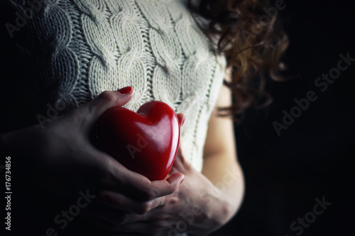 Hands female heart breast