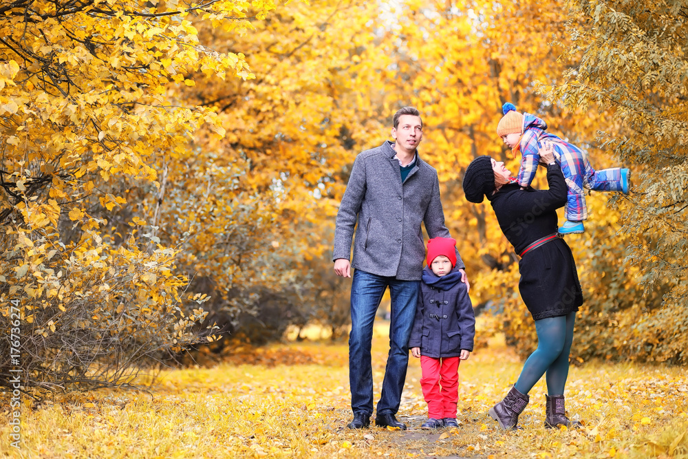 Family in autumn park in the afternoon Family in autumn park in the afternoon