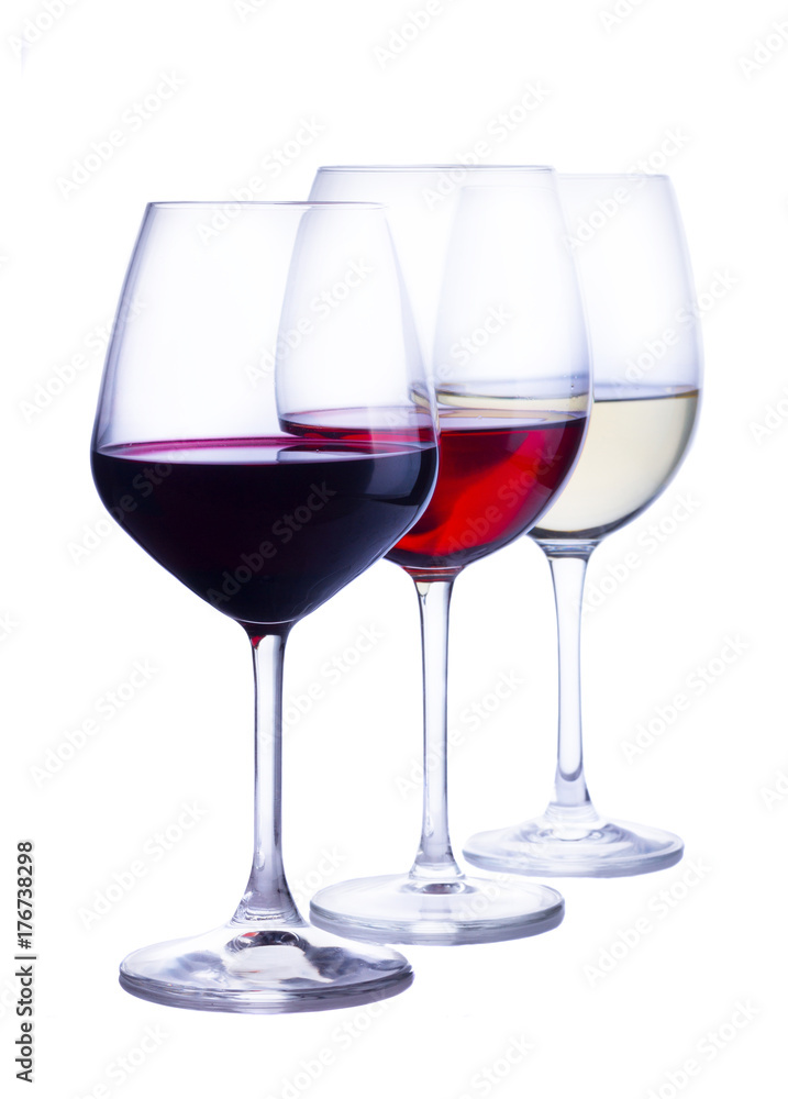Row of three wine glasses with red, white and rose wine isolated on white background Row of three wine glasses with red, white and rose wine isolated on white background