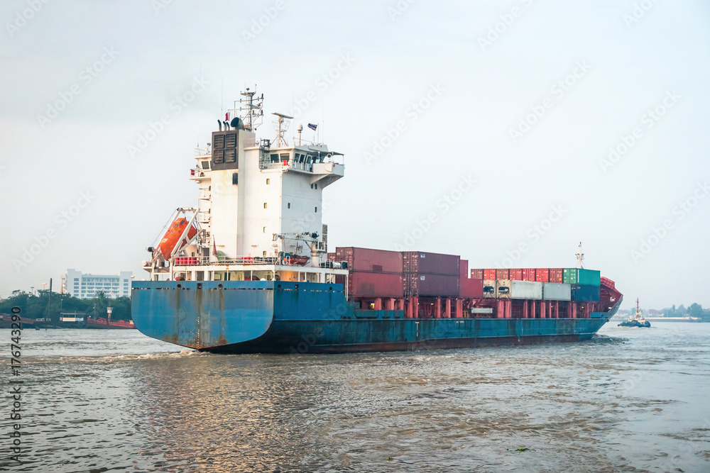 A cargo ship is sailing out into the ocean. A cargo ship is sailing out into the ocean.