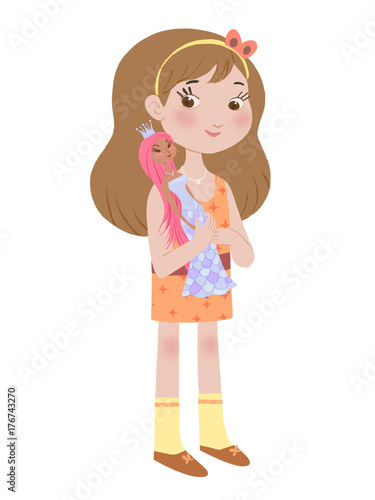 Small girl holding doll in her hand