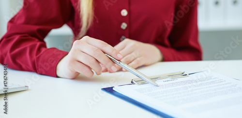 Closeup of business woman explaining  his new business partner the terms of the agreement or contract. Selective focus.