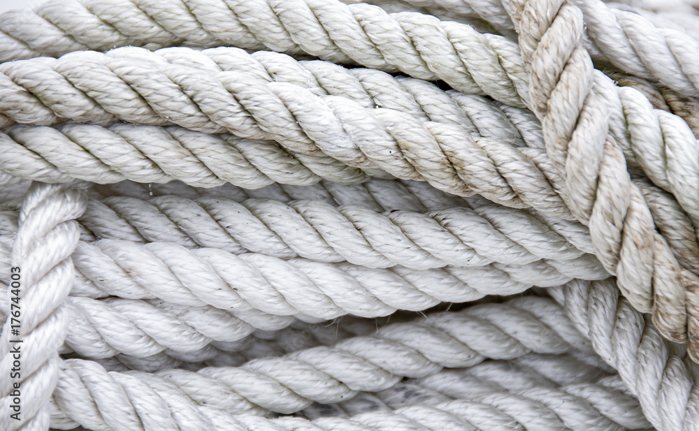 close up of tangled and twisted grungy white nautical rope close up of tangled and twisted grungy white nautical rope
