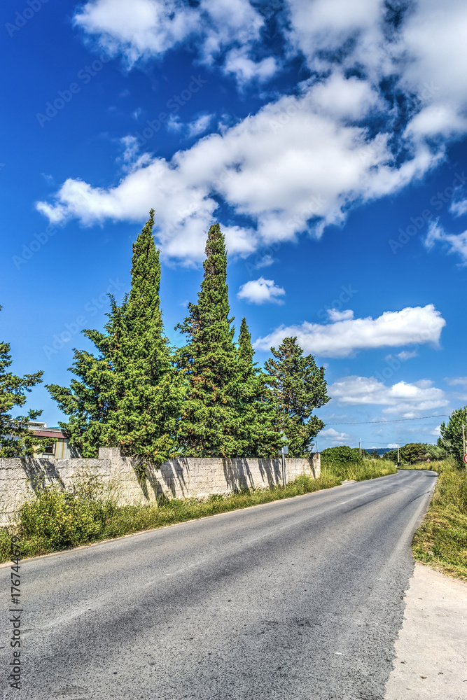 Clouds over a country road in Sardinia