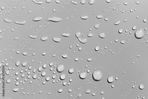 Water drops on a grey surface, background