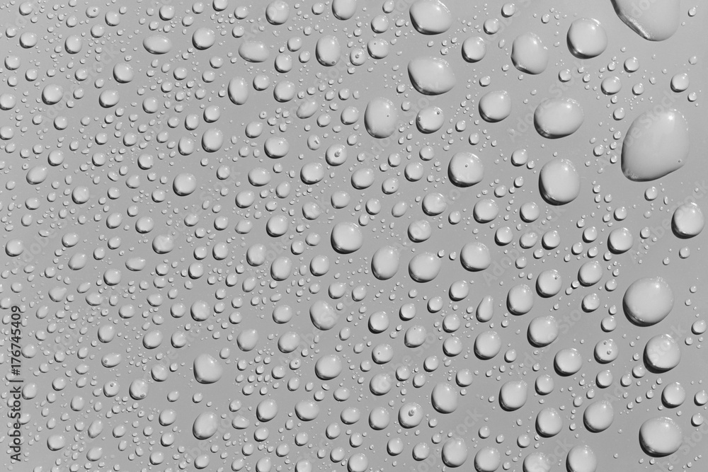Water drops on a grey surface, background Water drops on a grey surface, background