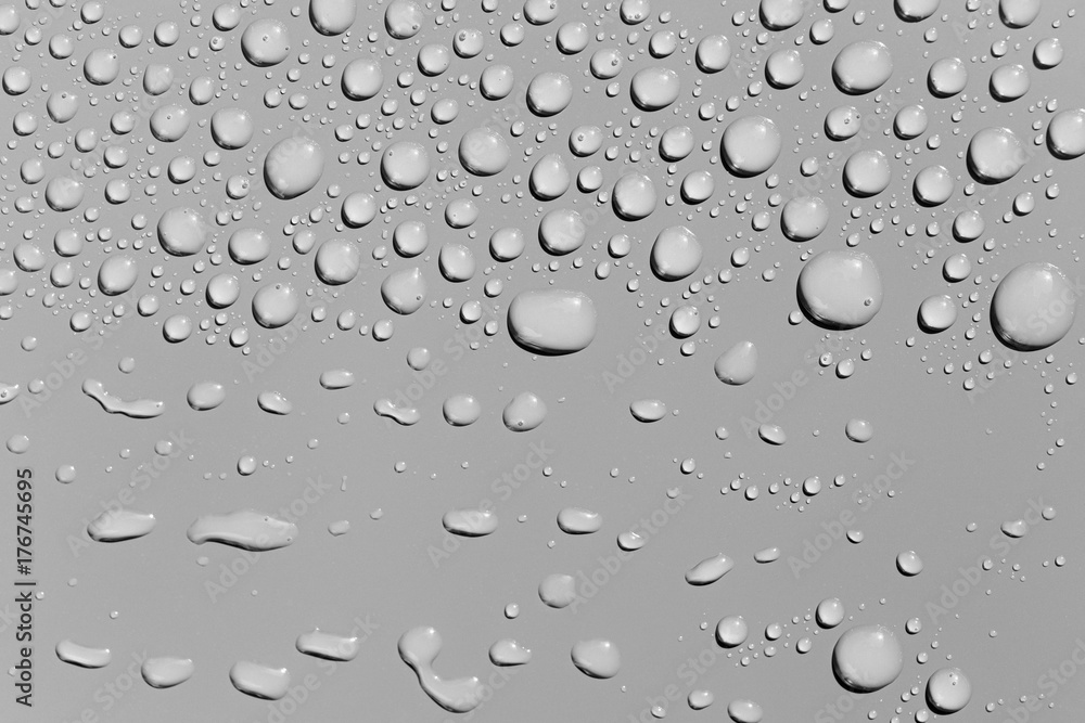 Water drops on a grey surface, background Water drops on a grey surface, background