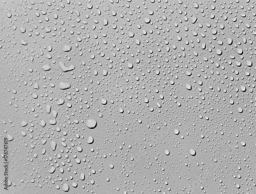 Water drops on a grey surface, background