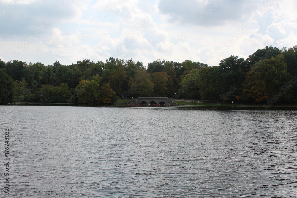 The lake in the park with the bridge in the background.