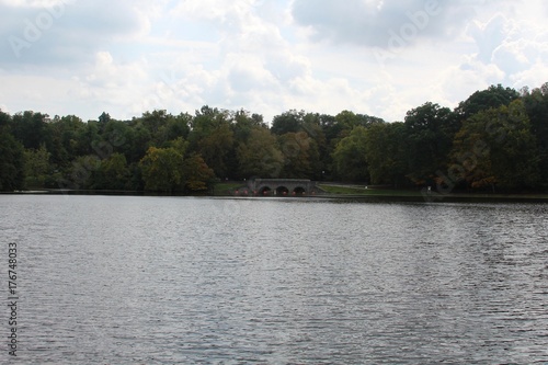The lake in the park with the bridge in the background.