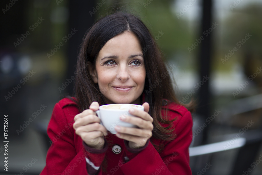young woman enjoying a coffee young woman enjoying a coffee