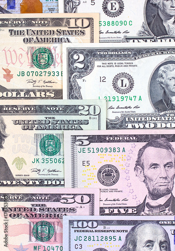 Abstract american dollar bills of different denomination background.