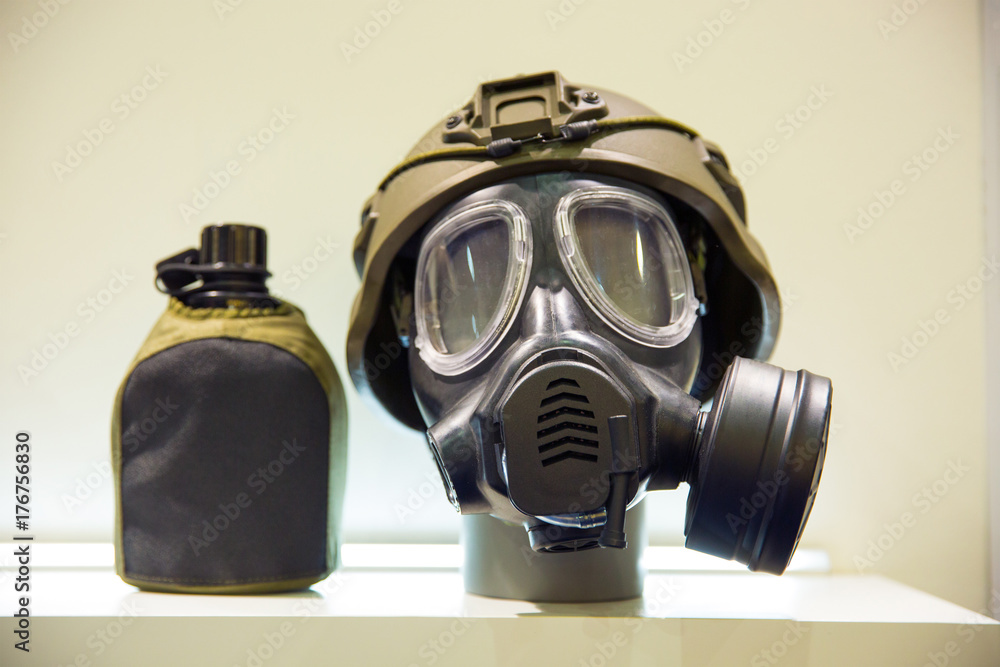 Military gas mask, helmet and water jar. Outfit soldier. Stock Photo |  Adobe Stock