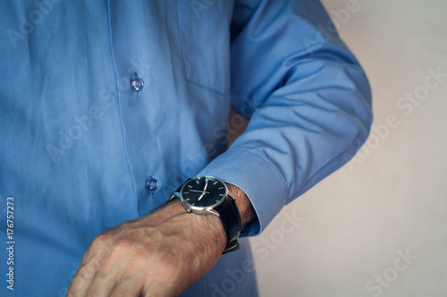 Businessman looking at his watch.