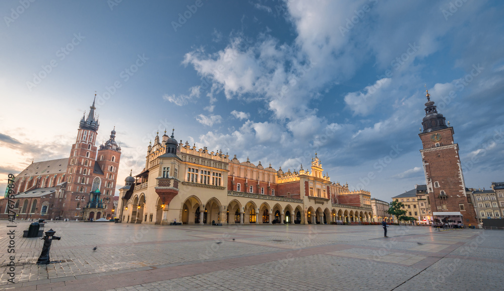 St Mary's church, Cloth Hall and Town Hall tower on the Main Market Square in Krakow, illuminated in the morning
