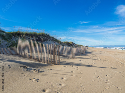 Wood fence at the sandy beach of Hatteras Island
