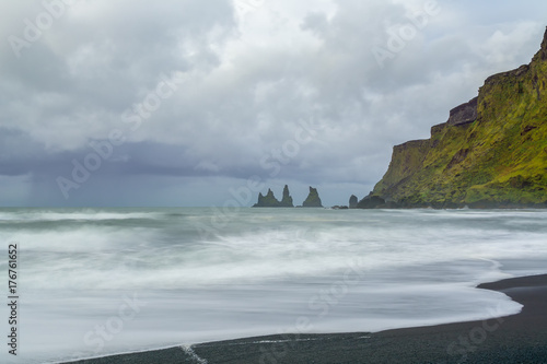 Reynisdrangar rock formations at black Reynisfjara Beach, Iceland