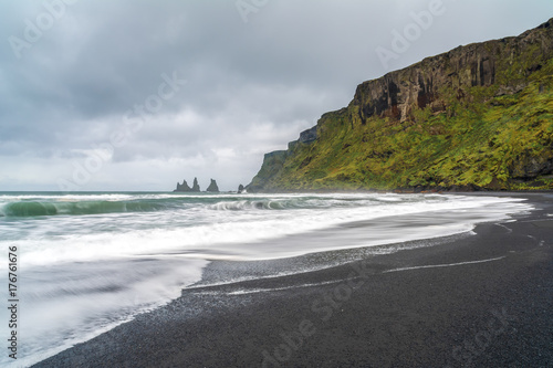 Reynisdrangar rock formations at black Reynisfjara Beach  Iceland
