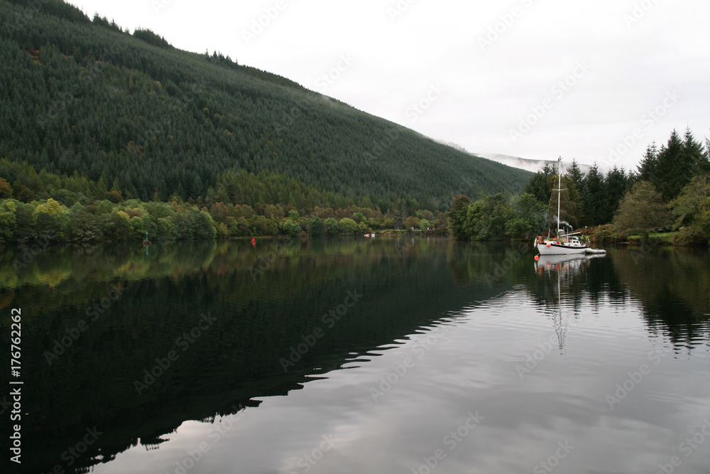 Scottish Loch with houseboat Scottish Loch with houseboat