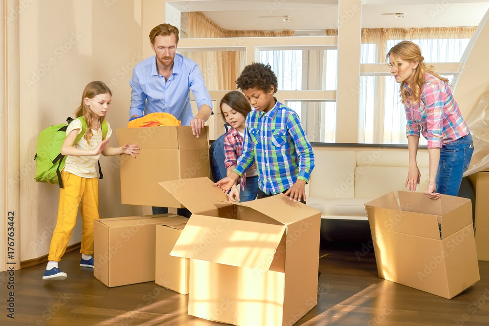 Parents and children, relocation. Family moving out, boxes. Parents and children, relocation. Family moving out, boxes.