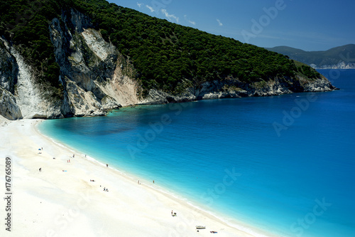 Sunbathers on the bone-white sands of Kefalonia's Myrtos beach considered one of the most beautiful in all the Greek islands.