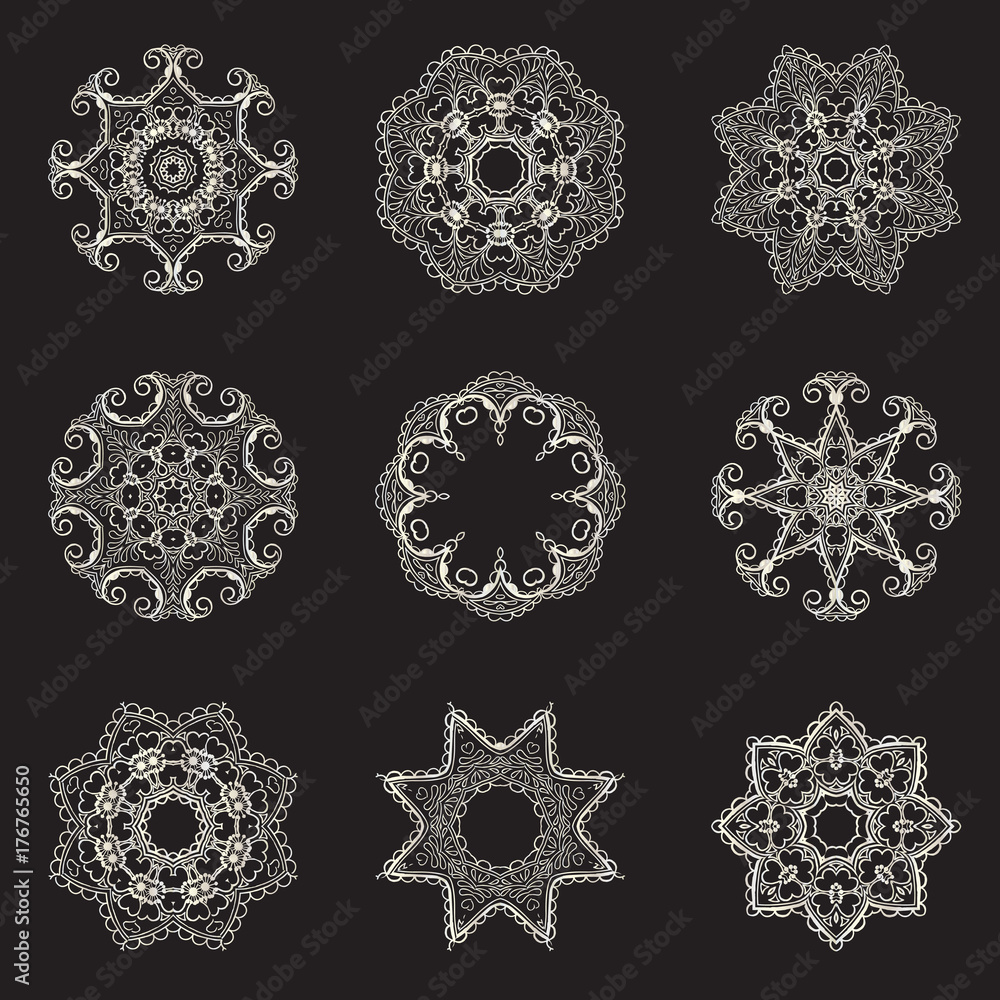 A large set of silver mandalas on a black background A large set of silver mandalas on a black background