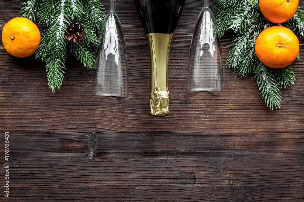Party with spruce, tangerine, champagne and glasses to celebrate New Year 2018 on wooden background top view mock-up Party with spruce, tangerine, champagne and glasses to celebrate New Year 2018 on wooden background top view mock-up