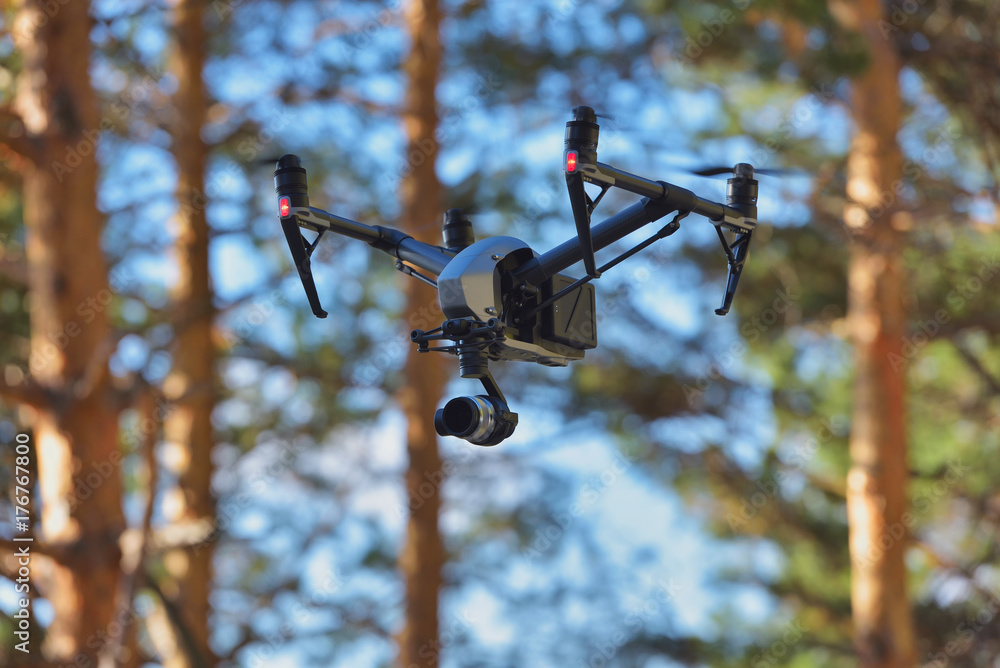 Obraz premium Flying drone on natural background