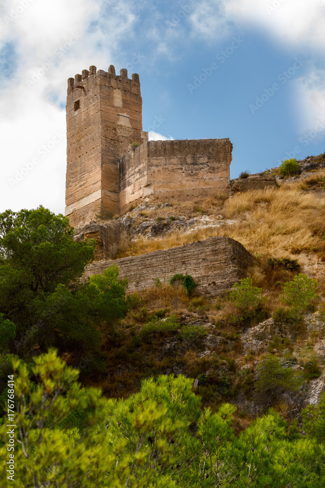 Old castle. Pliego, Murcia, Spain. Fortified tower. View from below.