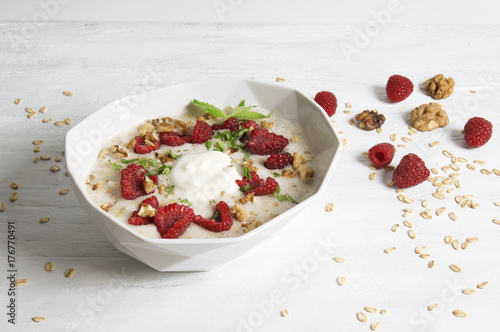 Overnight bircher muesli with walnuts, raspberry and mint photo