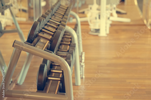 Rows of dumbbells in the gym