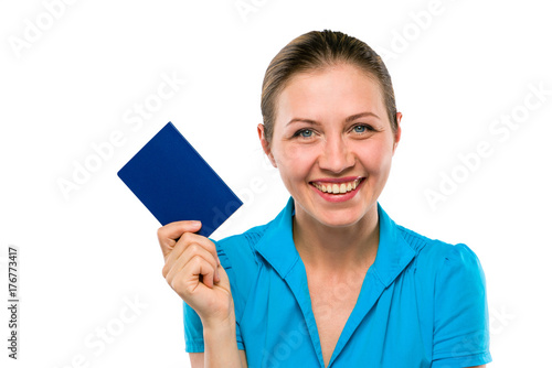 Young Woman is holding her New Passport or ID. Positively teeth wide smiling face. Isolated white background. Copy Space.