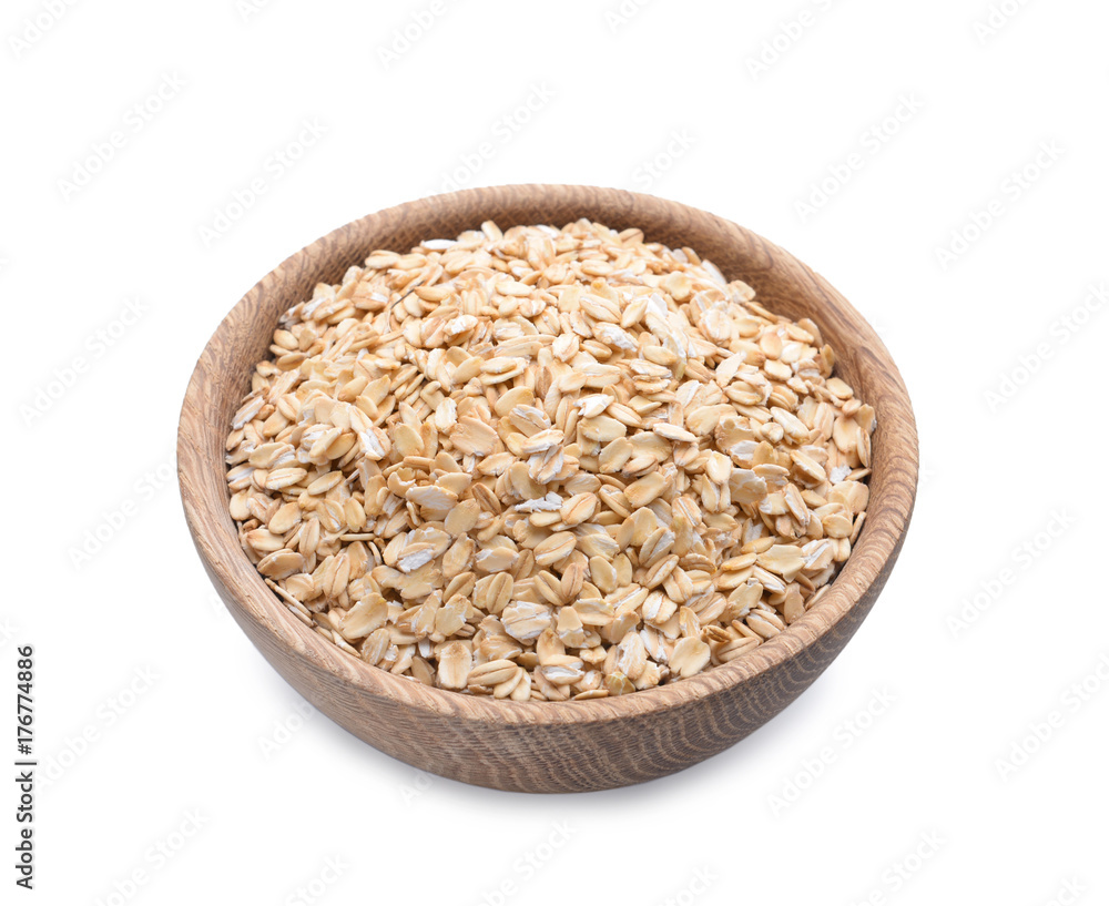 Wooden bowl with oatmeal flakes on white background