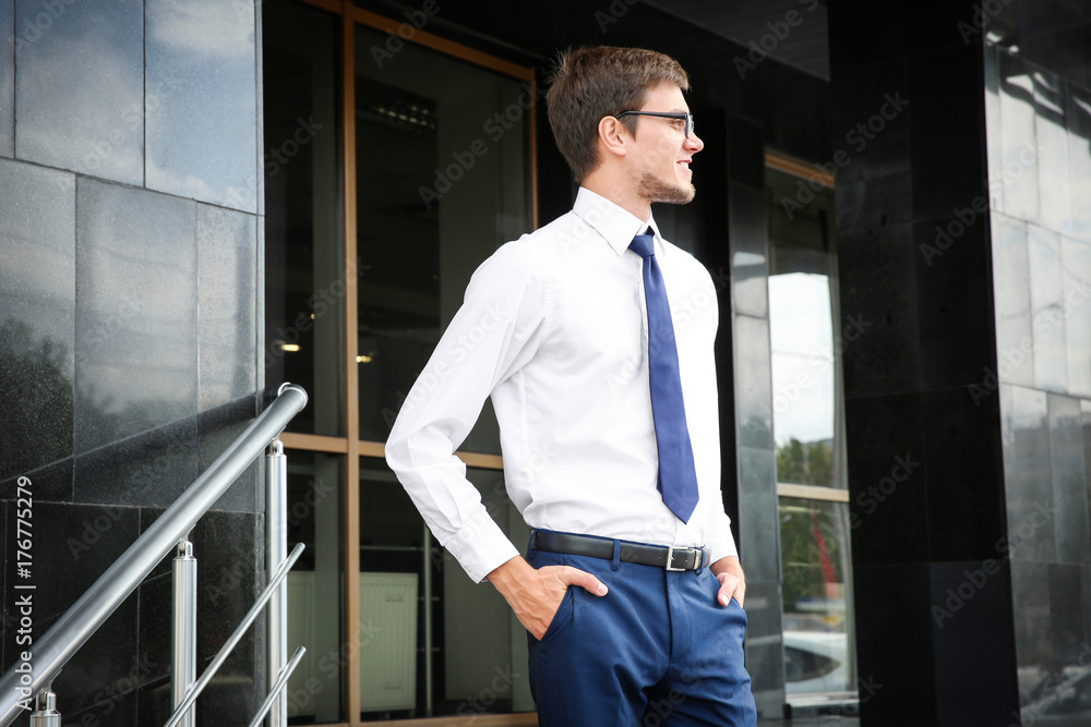 Attractive young man in formal wear on city street Attractive young man in formal wear on city street