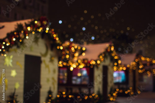Christmas decorations on the street, colorful holiday bokeh lights © Irina
