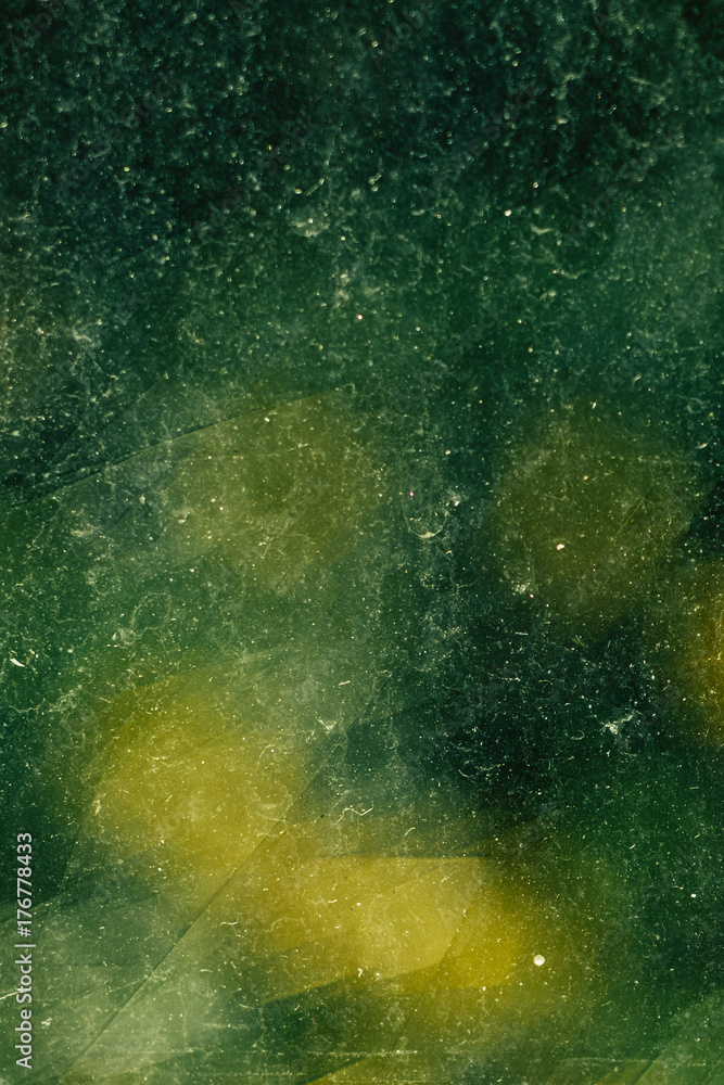 Fototapeta premium beautiful close up macro of dirty stained green glass
