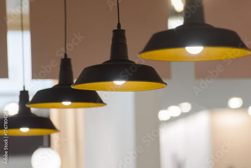 four pendant lamps blurred background photo