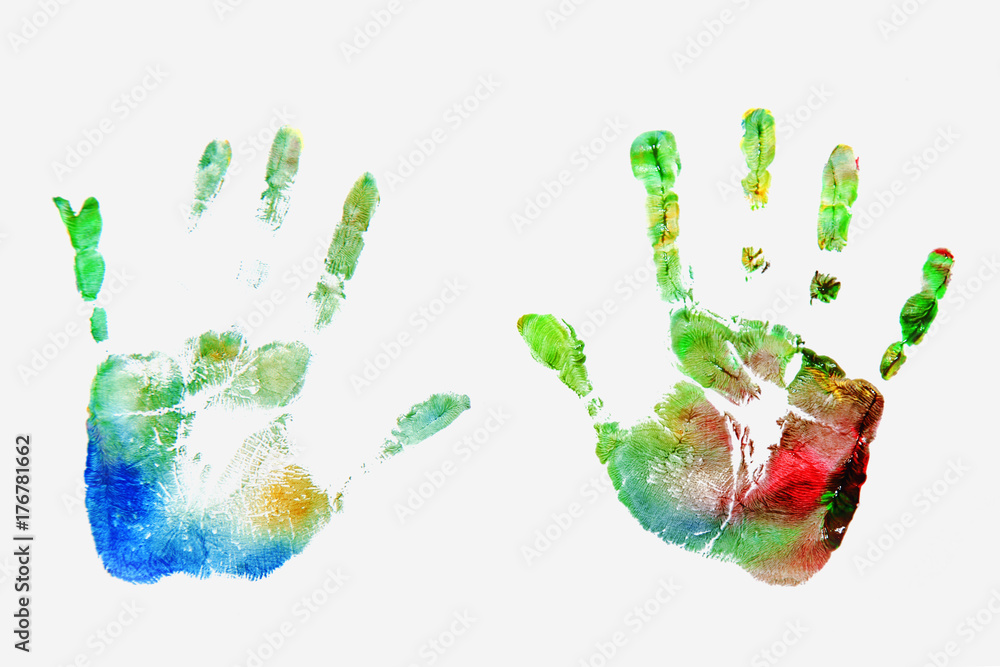 Close up of colored hand print of child on white background (happy childhood, art, fun, toy concept) Close up of colored hand print of child on white background (happy childhood, art, fun, toy concept)