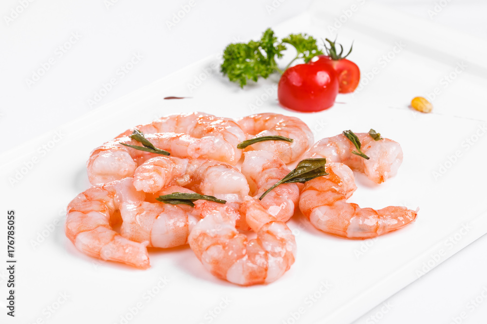 Roasted prawns on white plate on white background Roasted prawns on white plate on white background